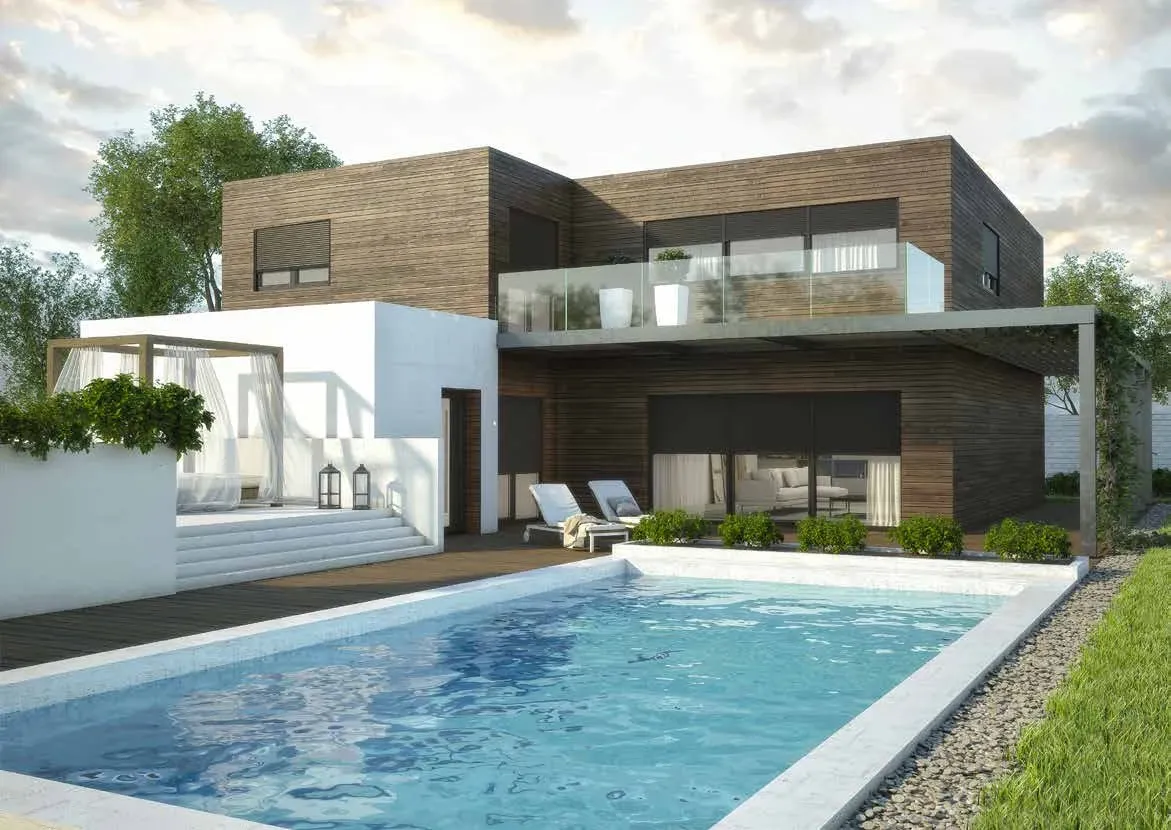 Maison contemporaine aux grandes baies vitrées au coucher du soleil